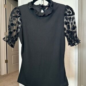 Elegant Black Top with Sheer Polka Dot Sleeves